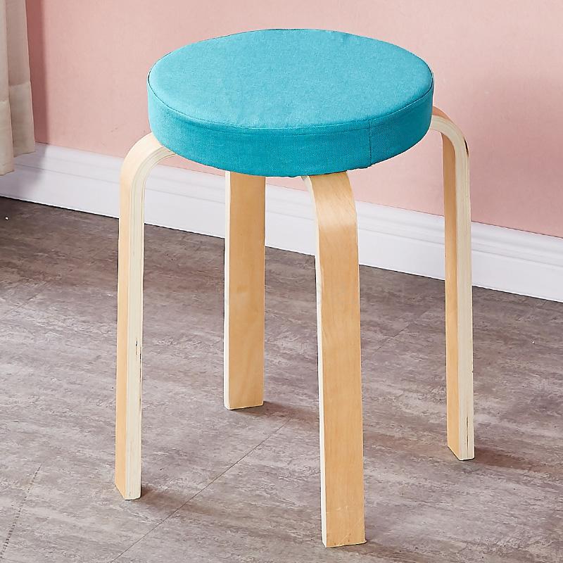 Tabouret scandinave avec assise ronde rembourrée en tissu et pieds en bois