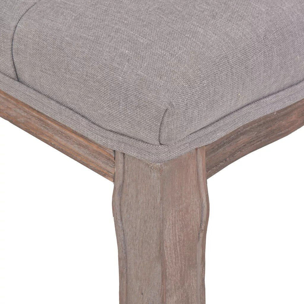 Banc design d'époque en bois et assise capitonnée en tissu gris