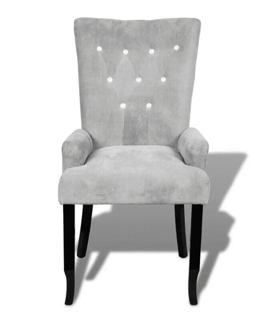 Chaise moderne en velours gris clair capitonnée et bois noir