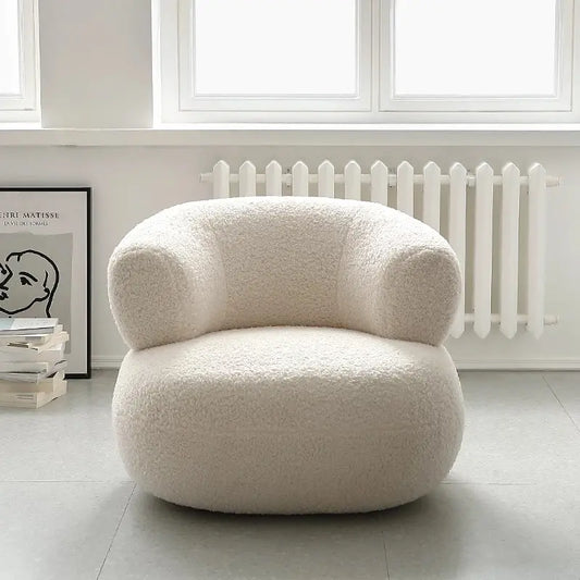 Fauteuil design bouclette crème bas à dossier enveloppant semi circulaire