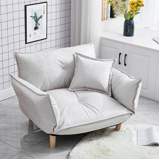 Fauteuil scandinave relax avec accoudoirs rabattables beige