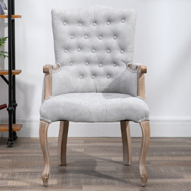 Fauteuil vintage capitonné avec armature bois