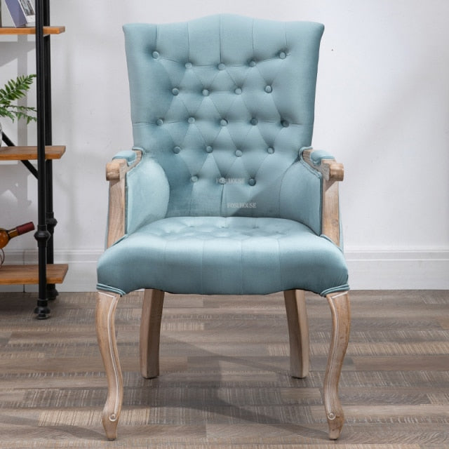 Fauteuil vintage capitonné avec armature bois