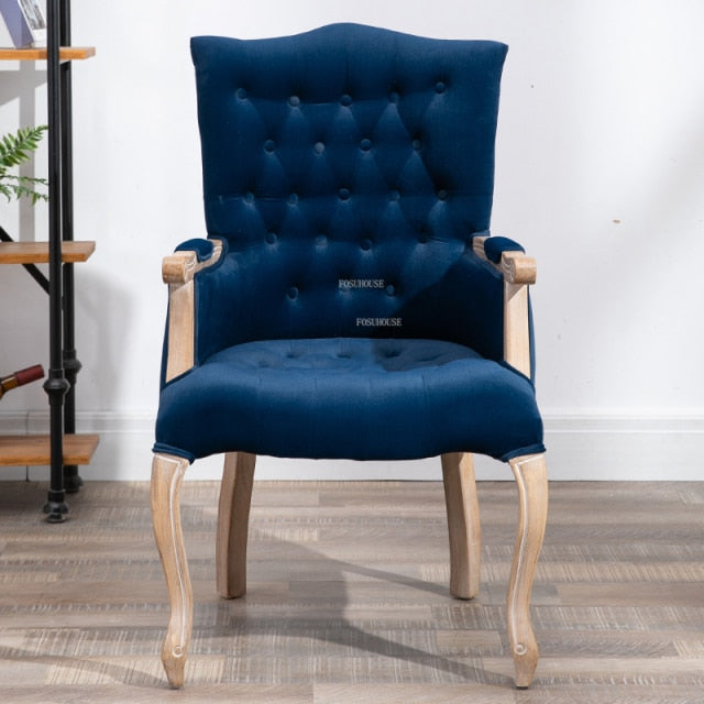 Fauteuil vintage capitonné avec armature bois