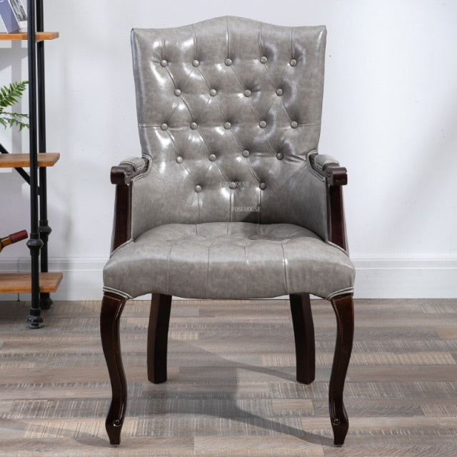 Fauteuil vintage capitonné avec armature bois