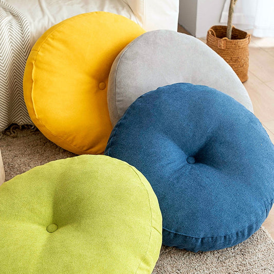 Coussin de sol rond avec capiton unique