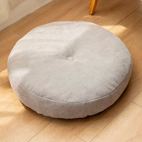 Coussin de sol rond avec capiton unique