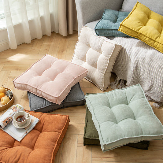 Coussin carré adaptable sol ou siège en tissu capitonné