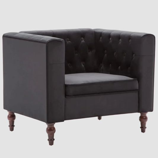 Fauteuil chesterfield en velours noir, vue de trois quarts