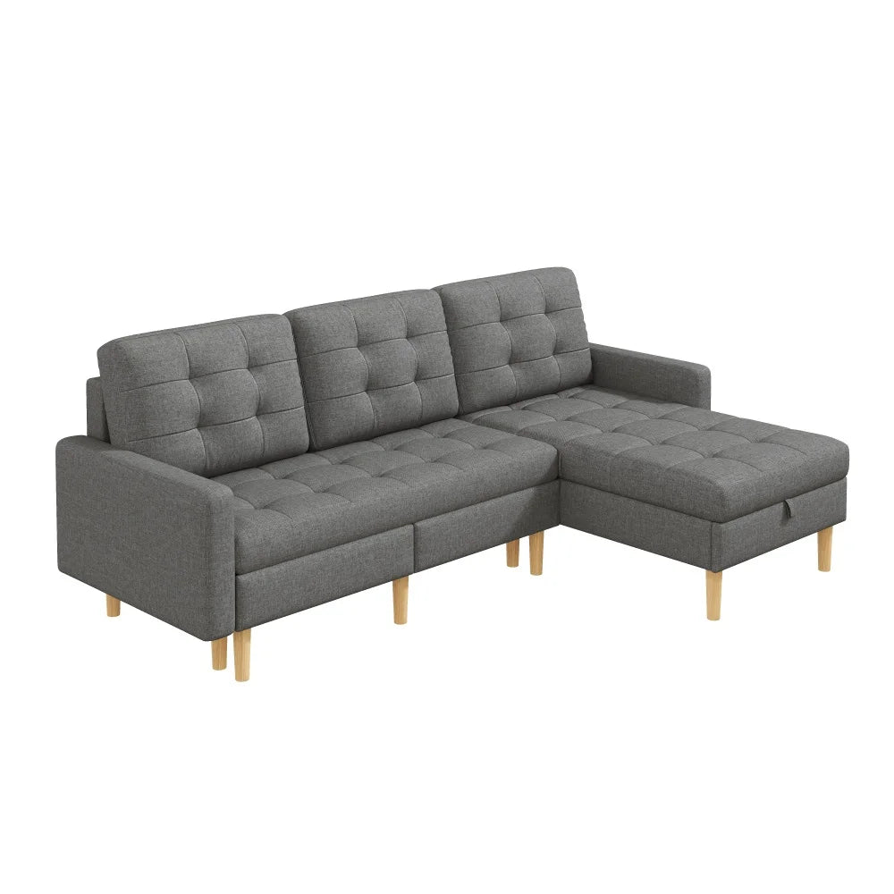 Canapé chesterfield d'angle convertible en tissu avec rangement – gris, vue de trois quarts sur fond blanc