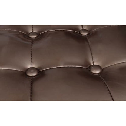 Détail des boutons et des coutures du capitonnage bronze