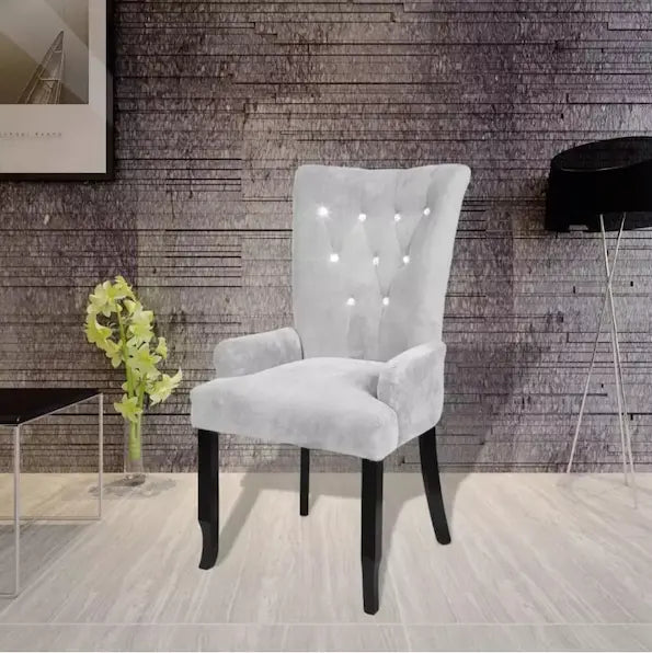 Chaise moderne en velours gris clair capitonnée et bois noir