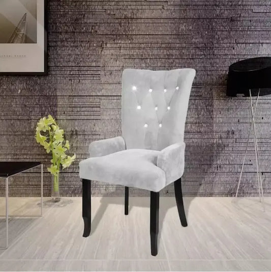 Chaise moderne en velours gris clair capitonnée et bois noir
