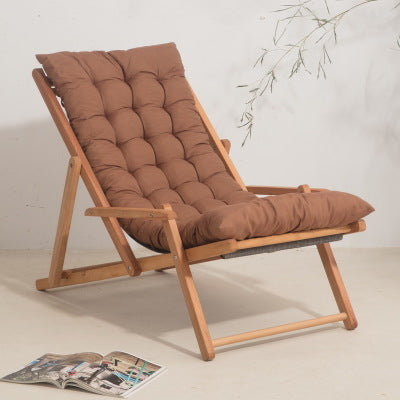 Chaise longue pliable en bois avec coussin matelassé