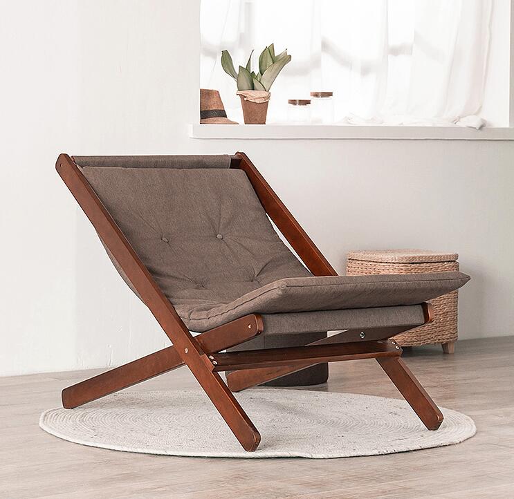 Chaise pliable en bois avec assise matelassée