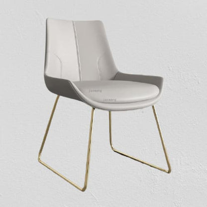 Chaise design en cuir gris et métal doré avec assise rembourrée