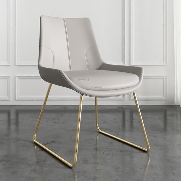 Chaise design en cuir gris et métal doré avec assise rembourrée