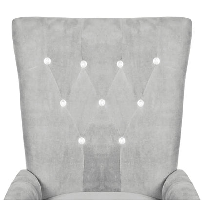 Chaise moderne en velours gris clair capitonnée et bois noir