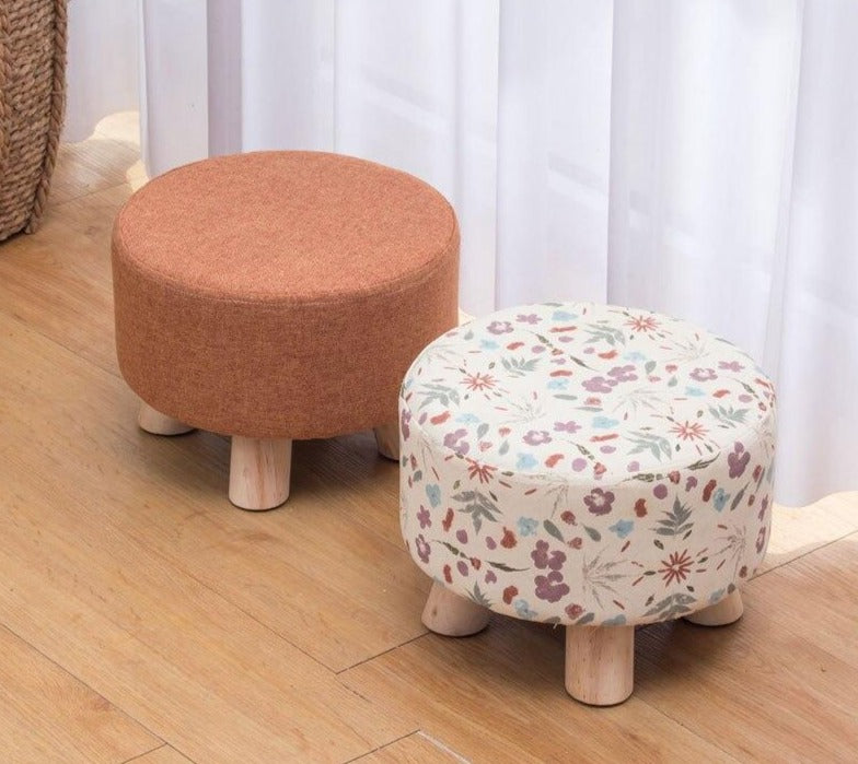 Tabouret scandinave bas avec assise ronde en tissu