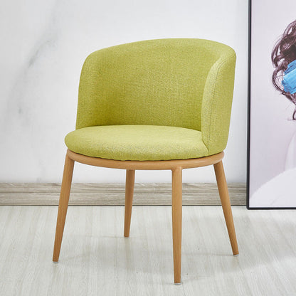 Chaise scandinave à large dossier en tissu vert et bois