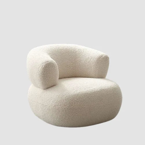 Fauteuil design bouclette crème bas à dossier enveloppant semi circulaire