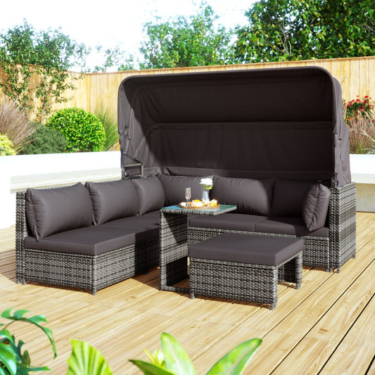 Canapé d'angle et salon de jardin gris avec capotte de protection