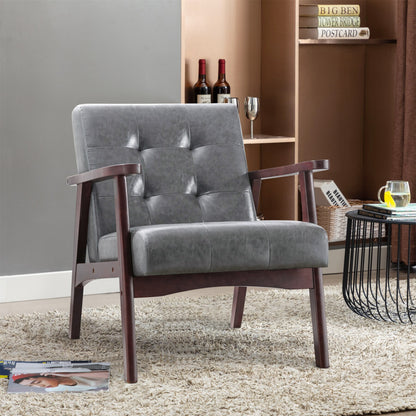 Fauteuil capitonné gris 