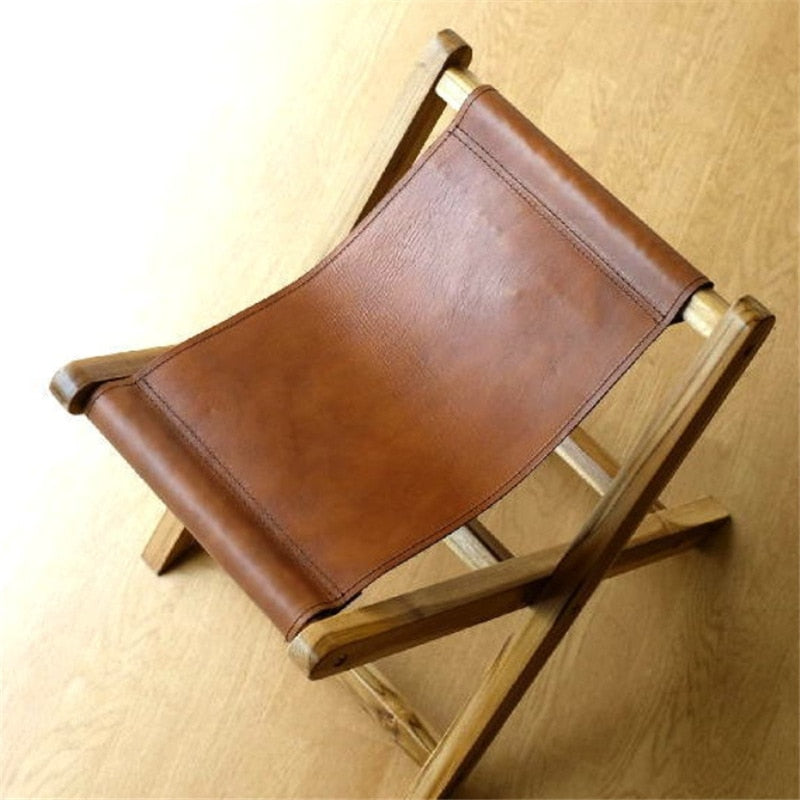 Tabouret pliable vintage en cuir et bois
