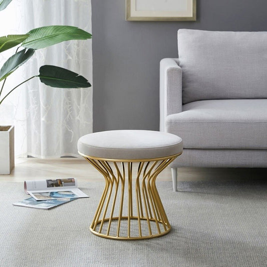 Tabouret design bas avec pied large à barreaux en métal doré