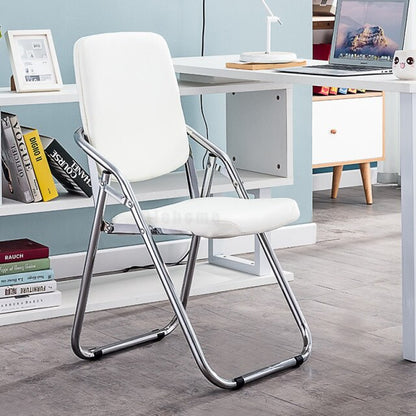 Chaise pliable assise confort rembourrée en similicuir et métal