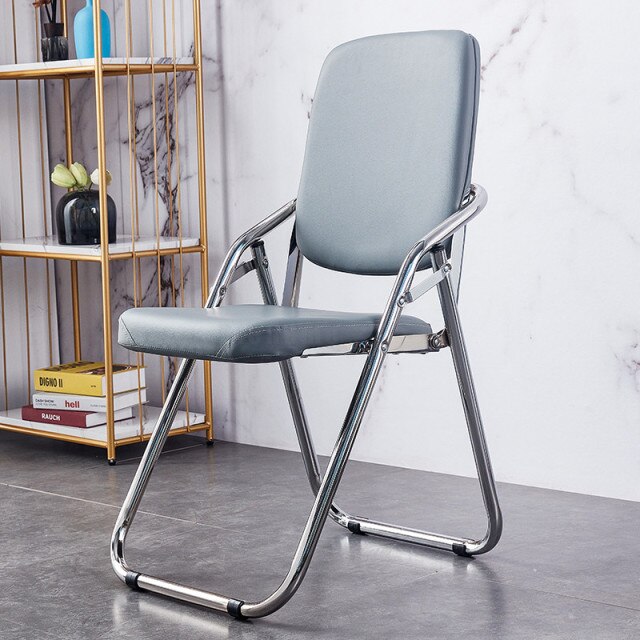 Chaise pliable assise confort rembourrée en similicuir et métal