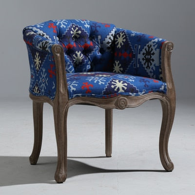 Fauteuil vintage capitonné impérial