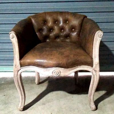 Fauteuil vintage capitonné impérial