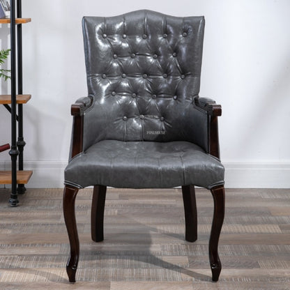 Fauteuil vintage capitonné avec armature bois