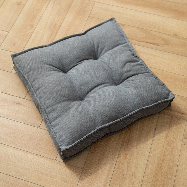 Coussin carré adaptable sol ou siège en tissu capitonné